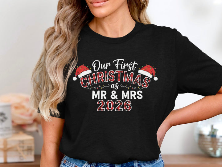Woman in a black Our First Christmas Mr and Mrs 2026 tee