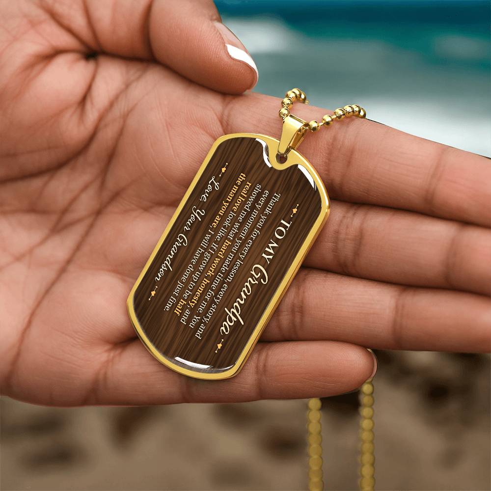 To My Grandpa Necklace from Grandson – gold dog tag held in hand to show size