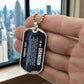 To My Grandson Necklace from Grandpa – silver dog tag held in hand to show size