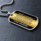 To My Granddaughter Necklace from Grandpa – dog tag necklace laid flat on a dark background