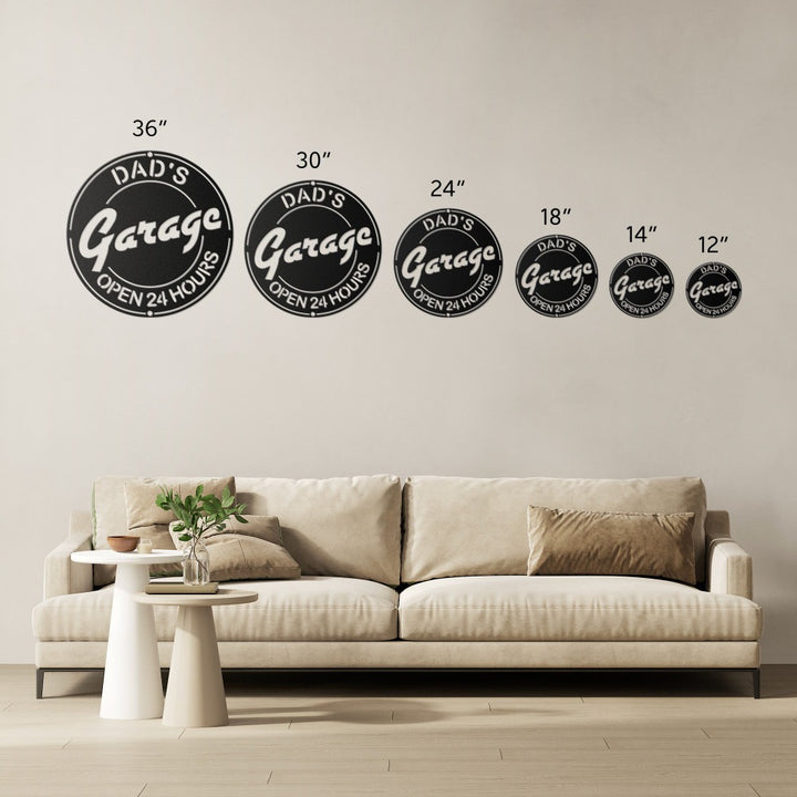 Black Dad’s Garage Open 24 Hours sign size comparison from 36 in down to 12 in over a sofa