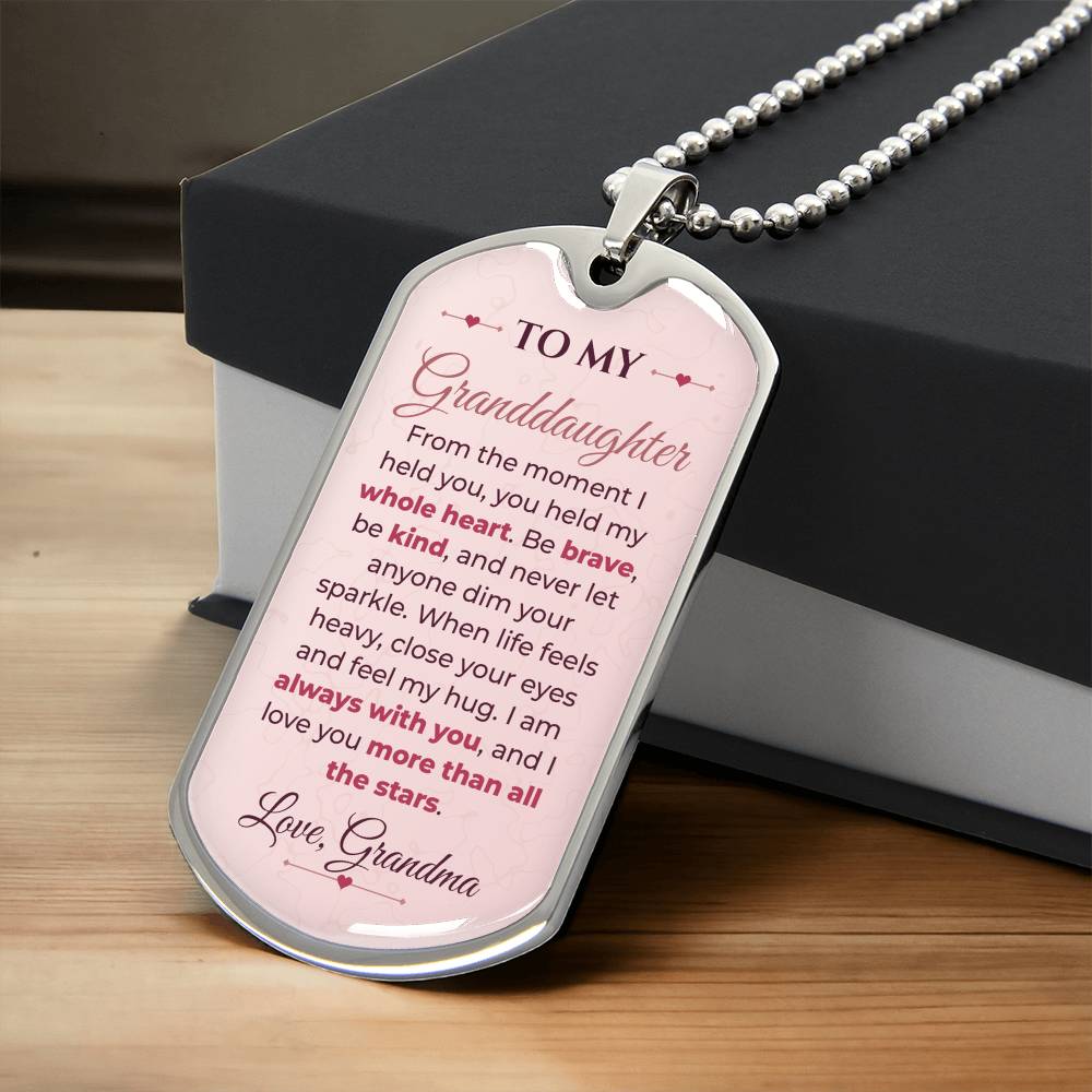 To My Granddaughter Necklace from Grandma – silver dog tag necklace resting on a gift box