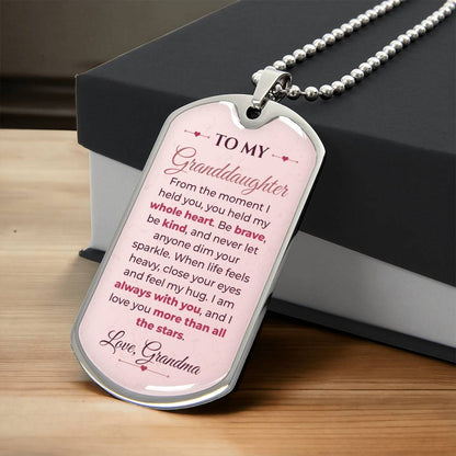 To My Granddaughter Necklace from Grandma – silver dog tag necklace resting on a gift box