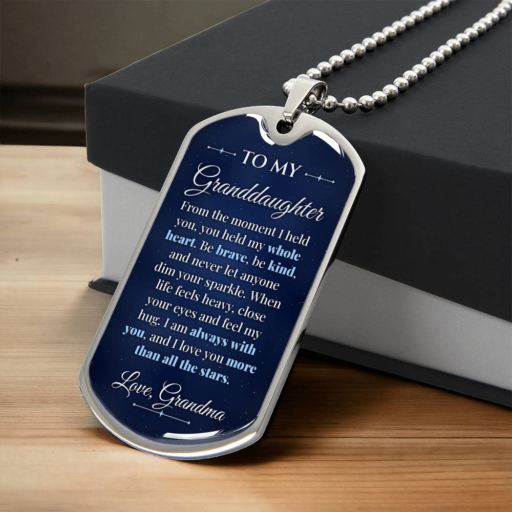 To My Granddaughter Necklace from Grandma – silver dog tag necklace resting on a gift box