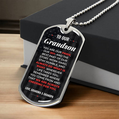 To Our Grandson Necklace from Grandma & Grandpa – silver dog tag necklace resting on a gift box