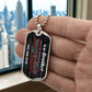 To My Brother Necklace from Sister – silver dog tag held in hand to show size