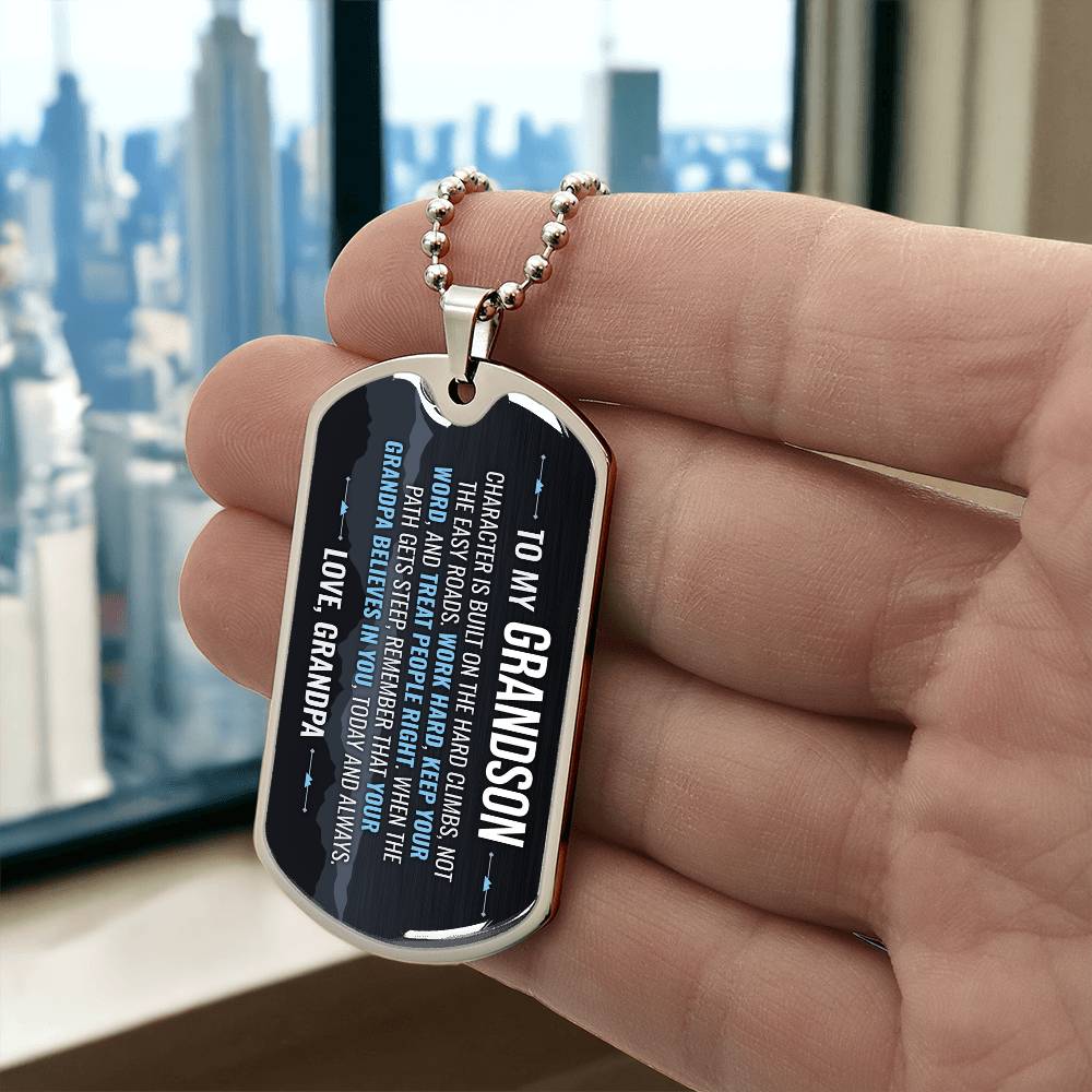To My Grandson Necklace from Grandpa – silver dog tag held in hand to show size