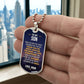 To My Son Necklace from Mom – silver dog tag held in hand to show size
