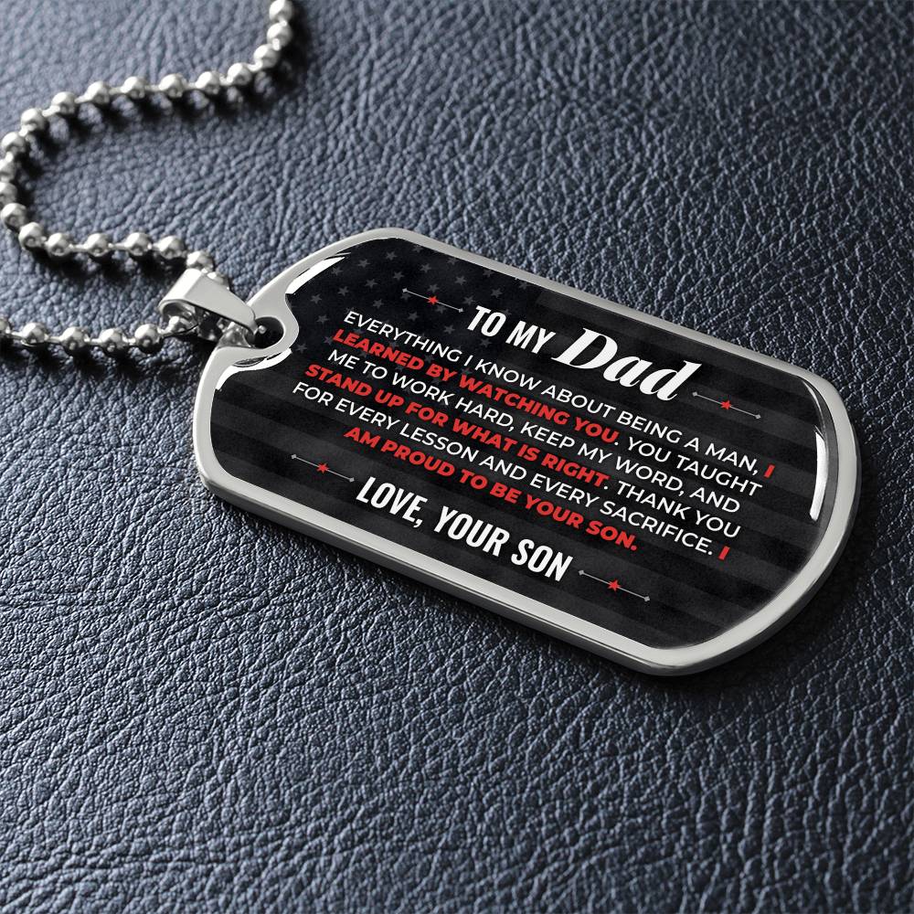 To My Dad Necklace from Son – silver dog tag necklace lying flat on black leather so the sideways message reads clearly