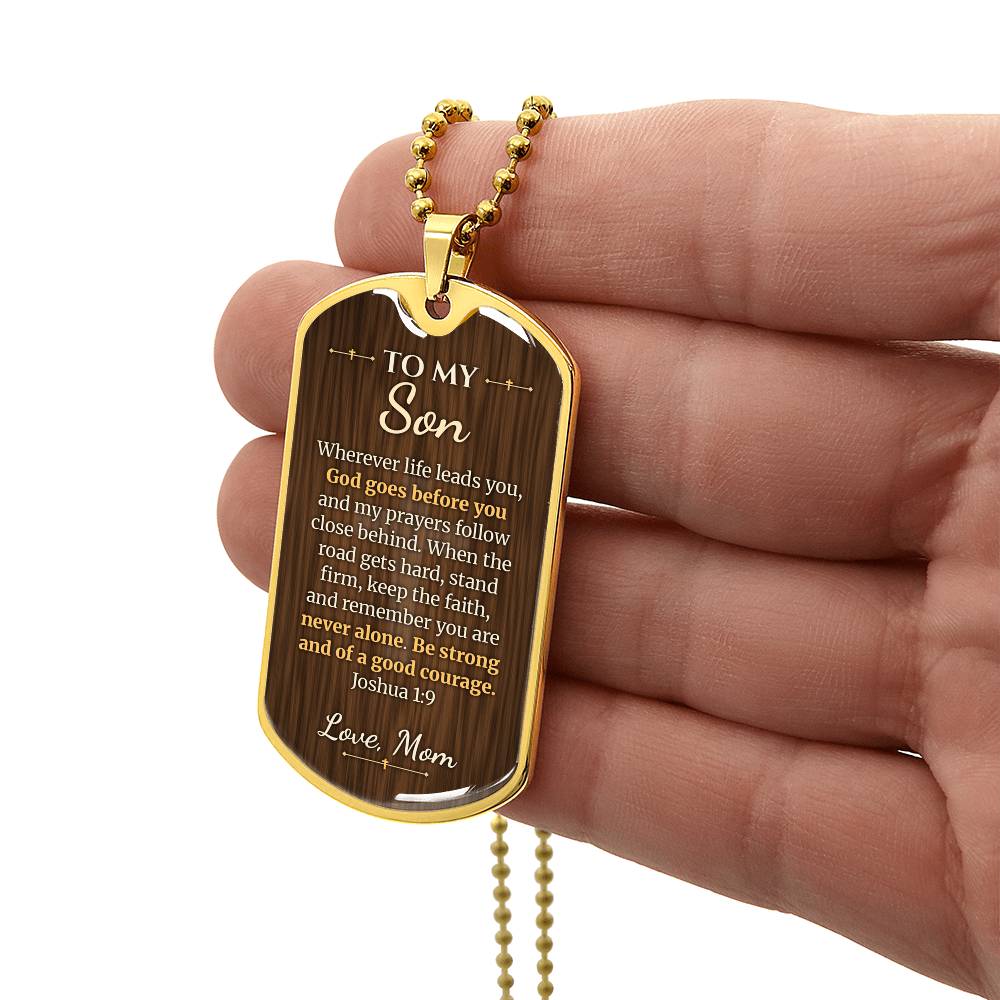 To My Son Necklace from Mom – gold dog tag held in hand to show size