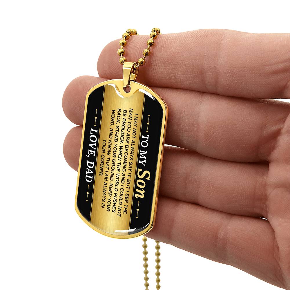 To My Son Necklace from Dad – gold dog tag held in hand to show size