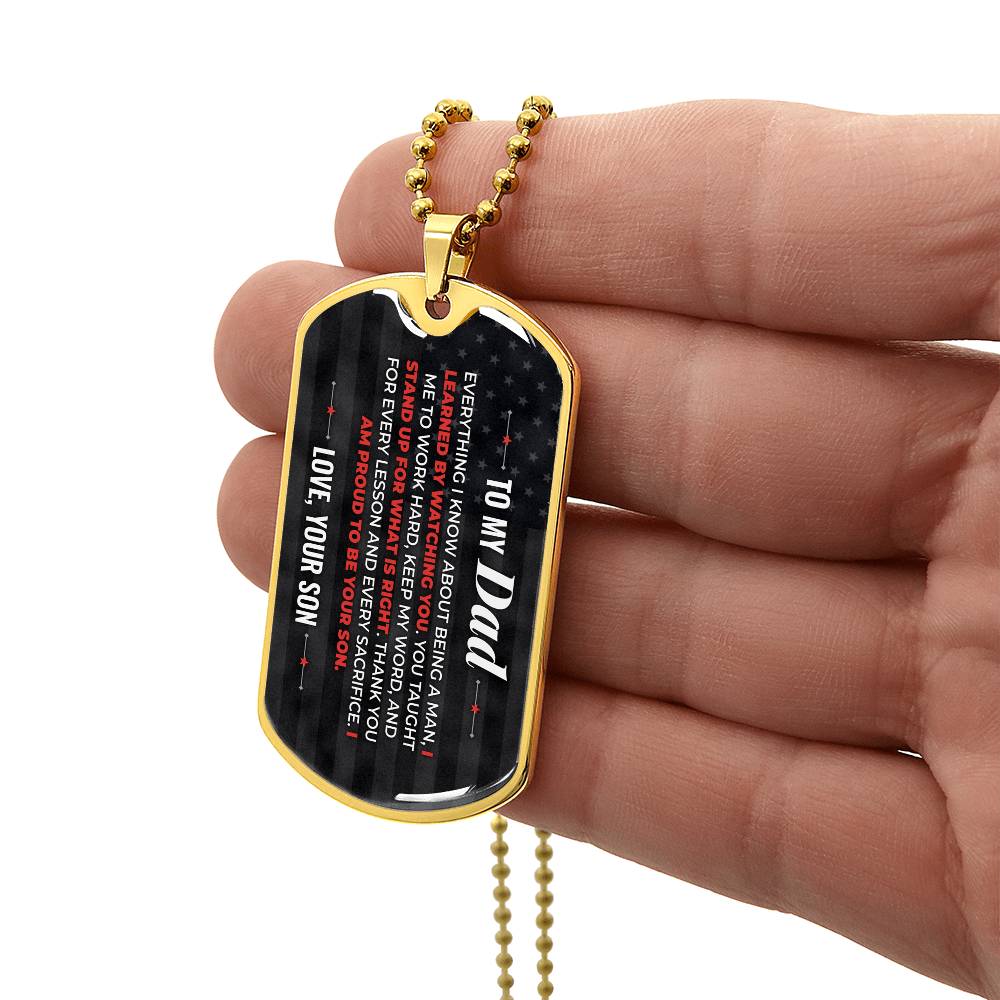 To My Dad Necklace from Son – gold dog tag held in hand to show size