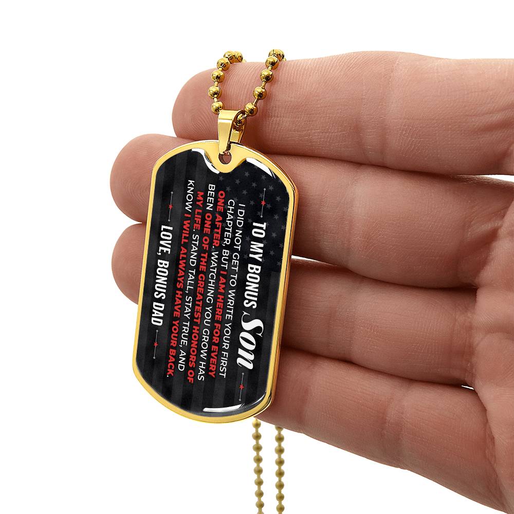 To My Bonus Son Necklace from Stepdad – gold dog tag held in hand to show size