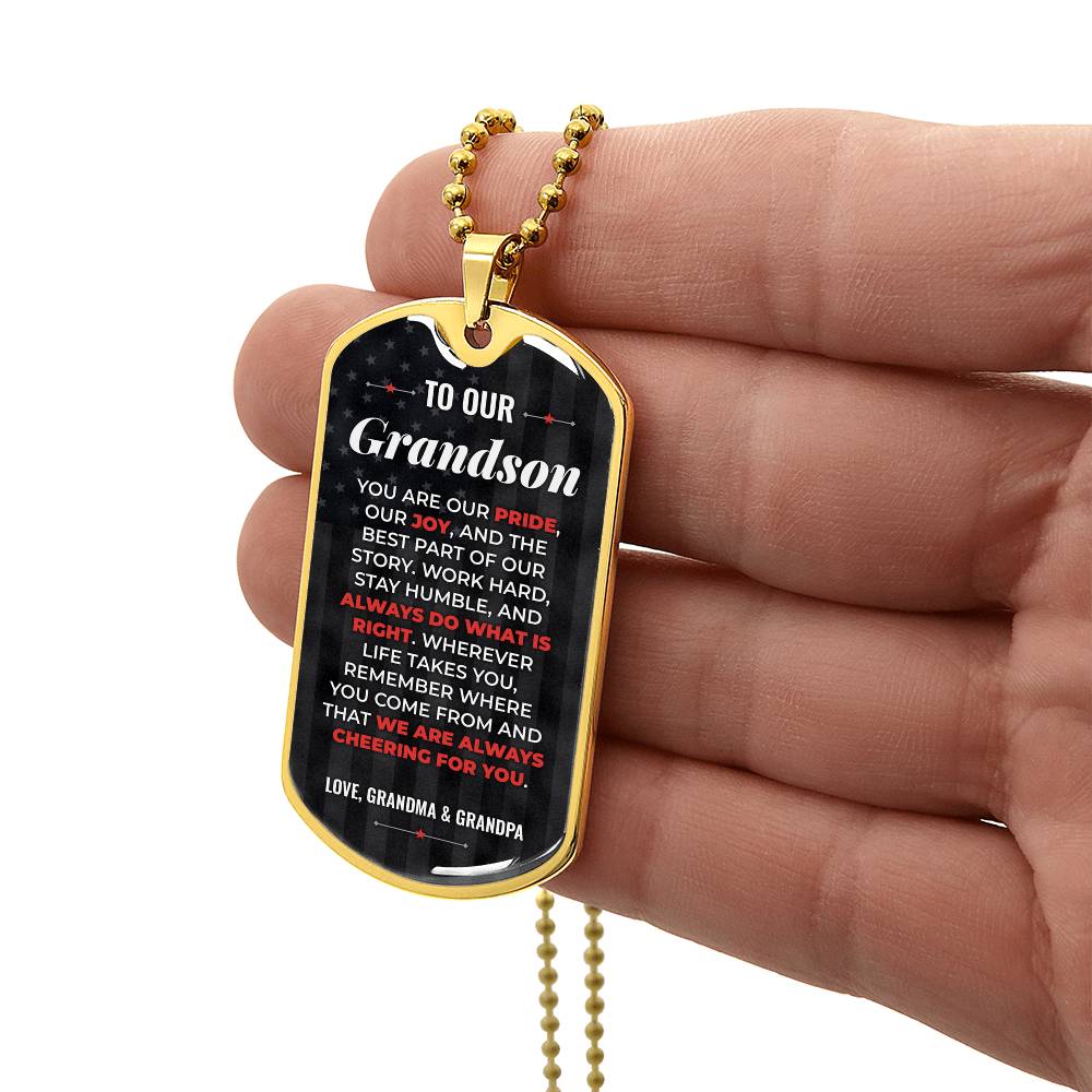 To Our Grandson Necklace from Grandma & Grandpa – gold dog tag held in hand to show size