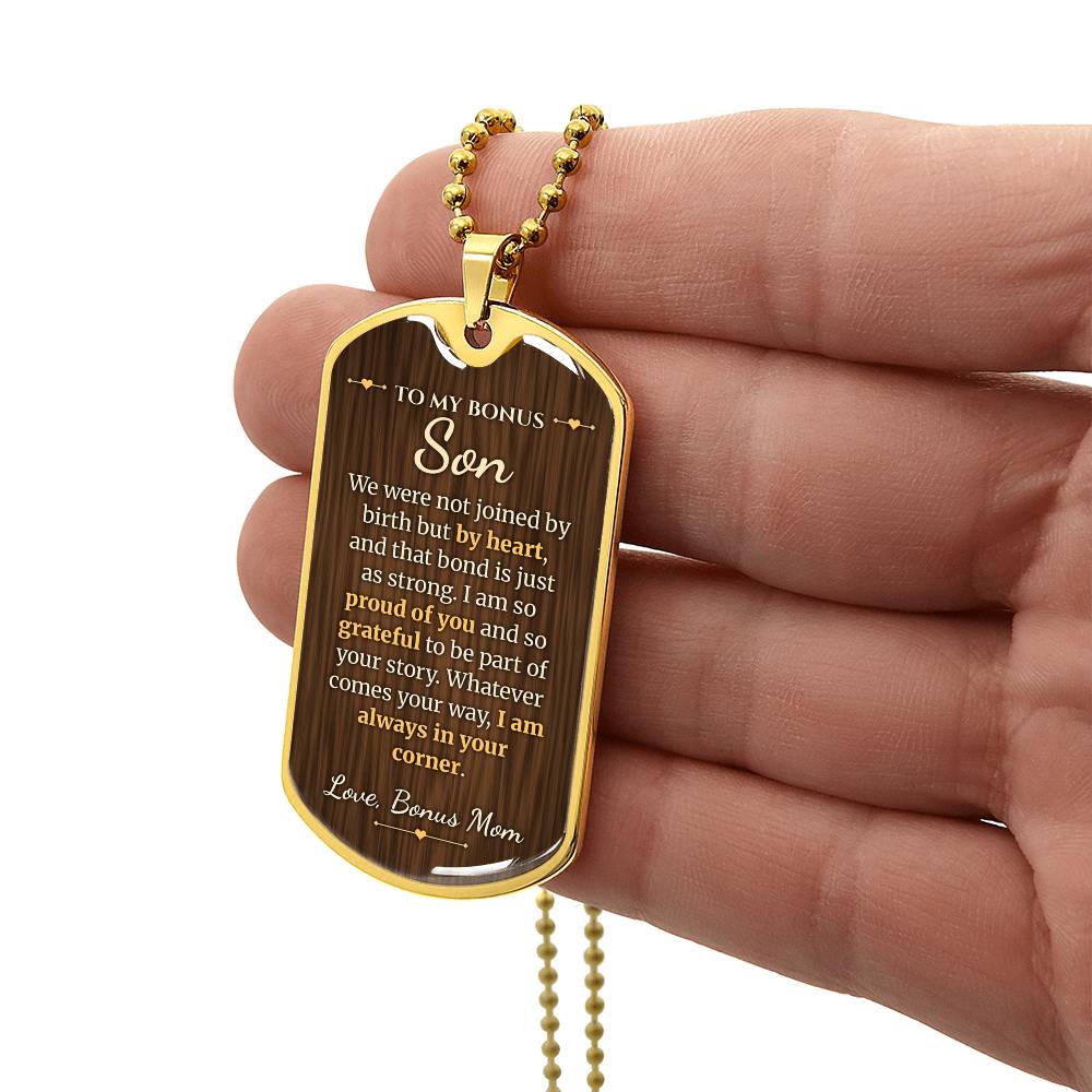 To My Bonus Son Necklace from Stepmom – gold dog tag held in hand to show size