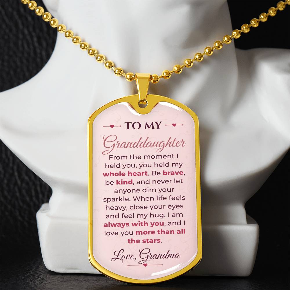 To My Granddaughter Necklace from Grandma – gold dog tag necklace displayed on a bust
