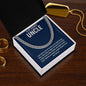 Stainless steel Cuban chain gift for uncle with message card in open box on a wooden table