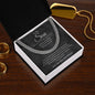 To My Son Cuban link chain on charcoal script card in gift box on wood table next to gold dog tag and rings