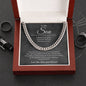 Silver Cuban link chain on the charcoal To My Son card in a mahogany-style luxury box beside black rings