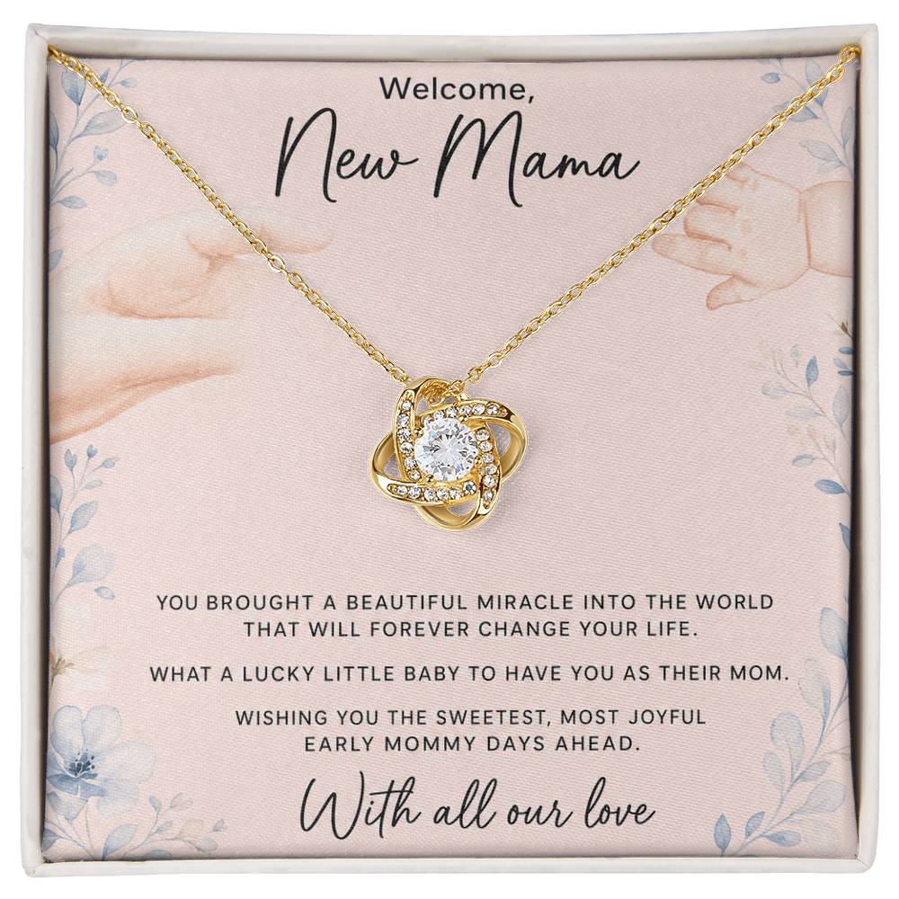 Yellow gold Love Knot necklace on Welcome New Mama message card in soft-touch box — oezzo