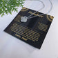 Black and gold To My Daughter card from Dad with the Love Knot necklace beside a pine sprig