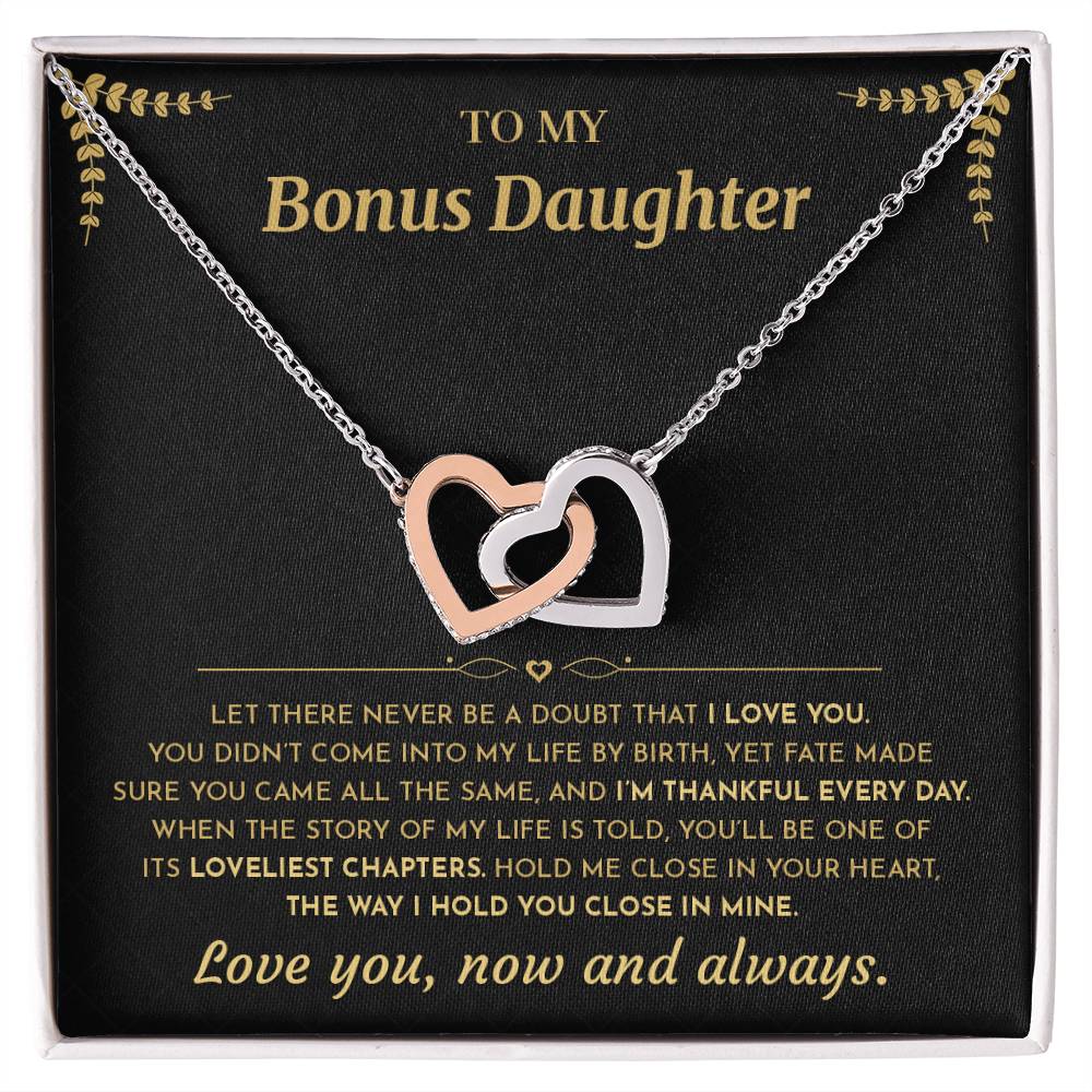 Interlocking Hearts necklace on the black and gold To My Bonus Daughter card in an open white gift box, front view