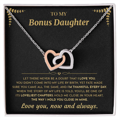 Interlocking Hearts necklace on the black and gold To My Bonus Daughter card in an open white gift box, front view