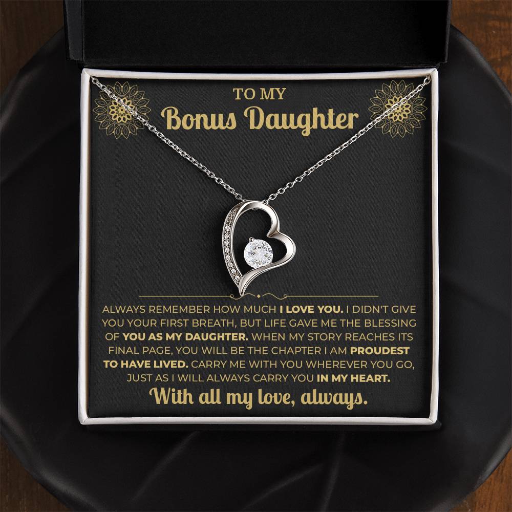 Open black gift box with the Forever Love heart necklace on the black and gold To My Bonus Daughter card