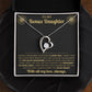 Open black gift box with the Forever Love heart necklace on the black and gold To My Bonus Daughter card