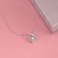 Forever Love heart necklace on a pink surface beside a pink gift box (Love, Dad black and gold card set)