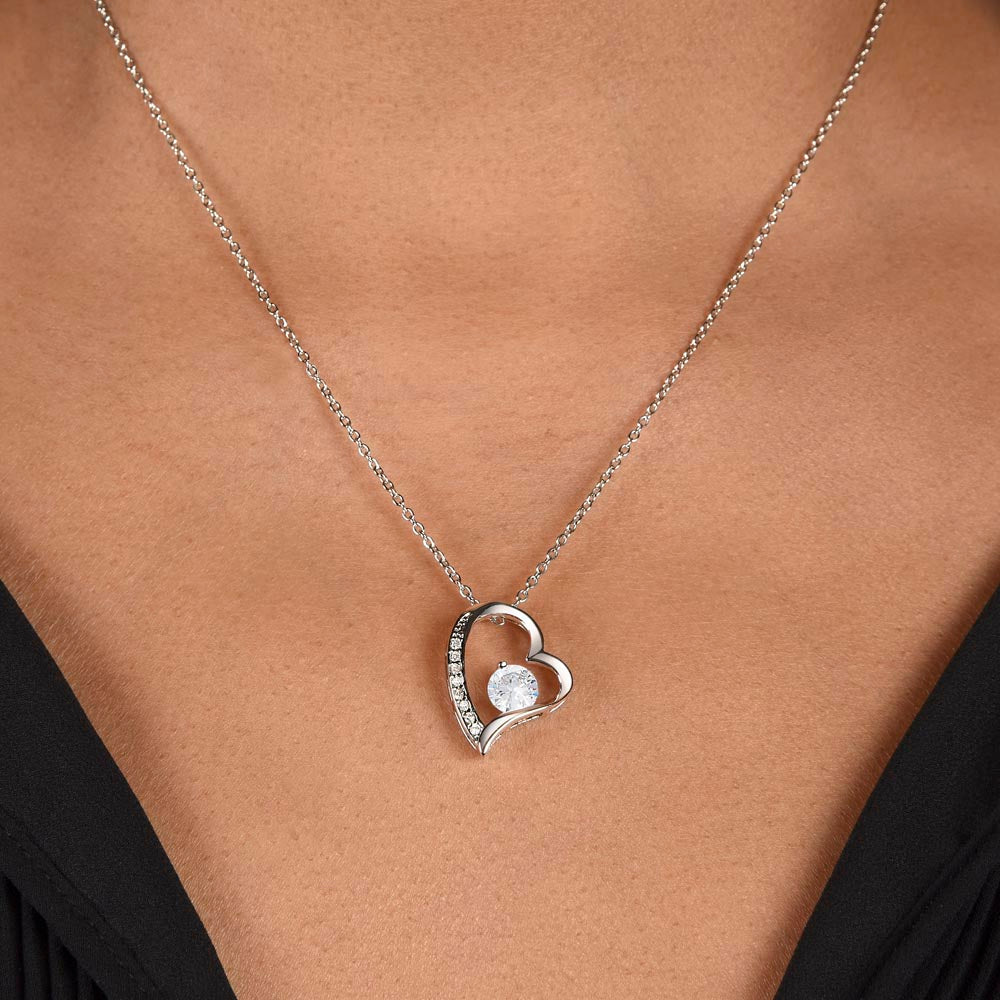Forever Love heart necklace worn on the neck with a black top (Love, Dad black and gold card set)
