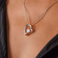 Forever Love heart pendant worn with a black top, close-up (Love, Grandma granddaughter set)