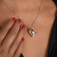 Woman touching the Forever Love heart pendant at her neckline (To My Bonus Daughter set)