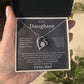 Hand holding an open black gift box with the charcoal To My Daughter card from Dad and heart pendant