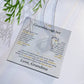Soft gray To My Granddaughter card from Grandma with heart necklace laid flat beside a pine sprig