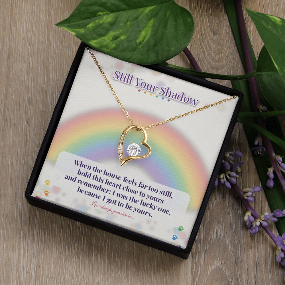 Yellow gold rainbow bridge necklace on card in gift box
