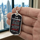To Our Grandson Necklace from Grandma & Grandpa – silver dog tag held in hand to show size