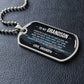 To My Grandson Necklace from Grandpa – dog tag necklace laid flat on a dark background
