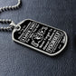 Silver Believe in Yourself son dog tag lying on black leather