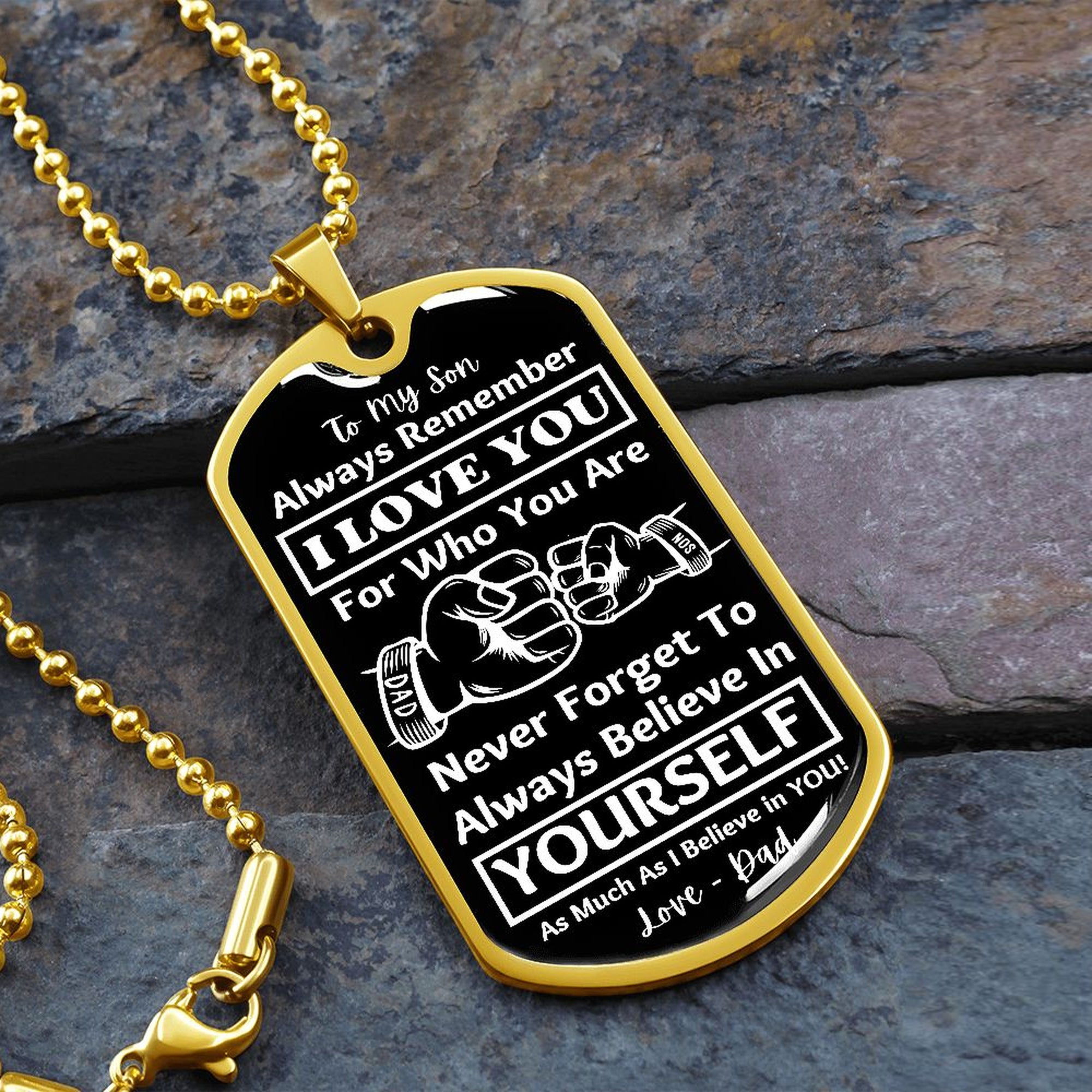 Gold-finish Believe in Yourself son dog tag necklace on slate stone