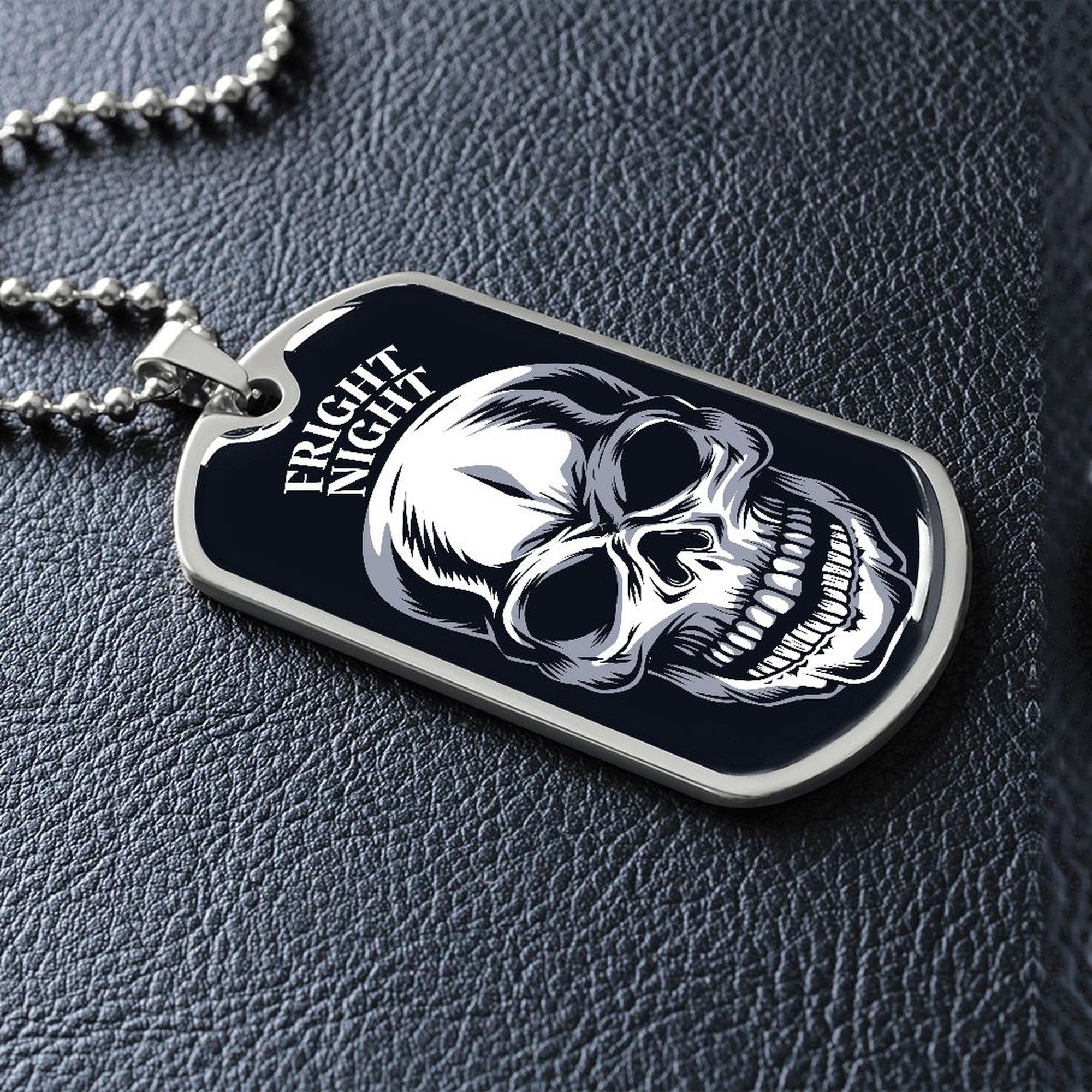 Silver Fright Night skull dog tag lying on black leather