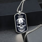 Silver Fright Night skull dog tag hanging over a black gift box