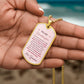 To My Granddaughter Necklace from Grandma – gold dog tag held in hand to show size