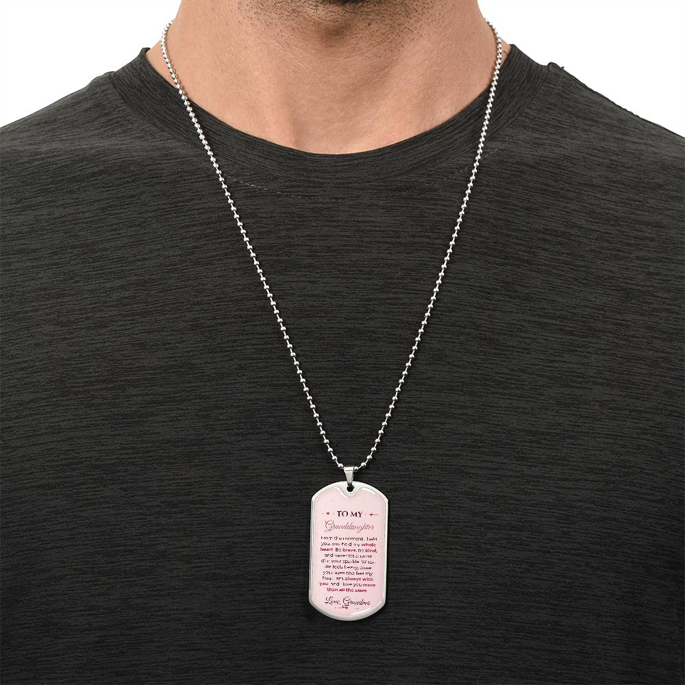 To My Granddaughter Necklace from Grandma – silver dog tag necklace worn with a dark t-shirt