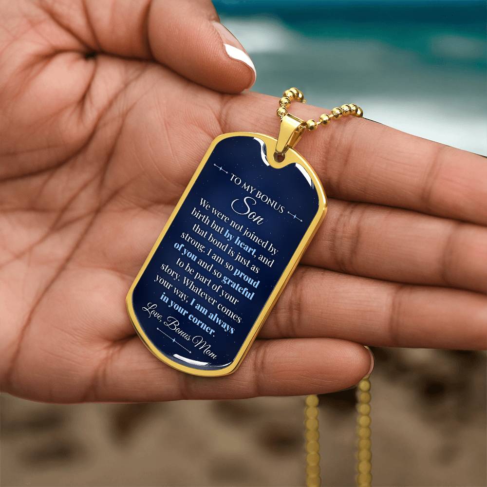 To My Bonus Son Necklace from Bonus Mom – gold dog tag held in hand to show size