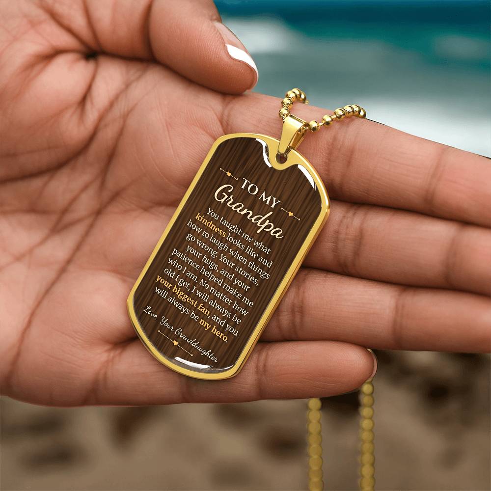 To My Grandpa Necklace from Granddaughter – gold dog tag held in hand to show size
