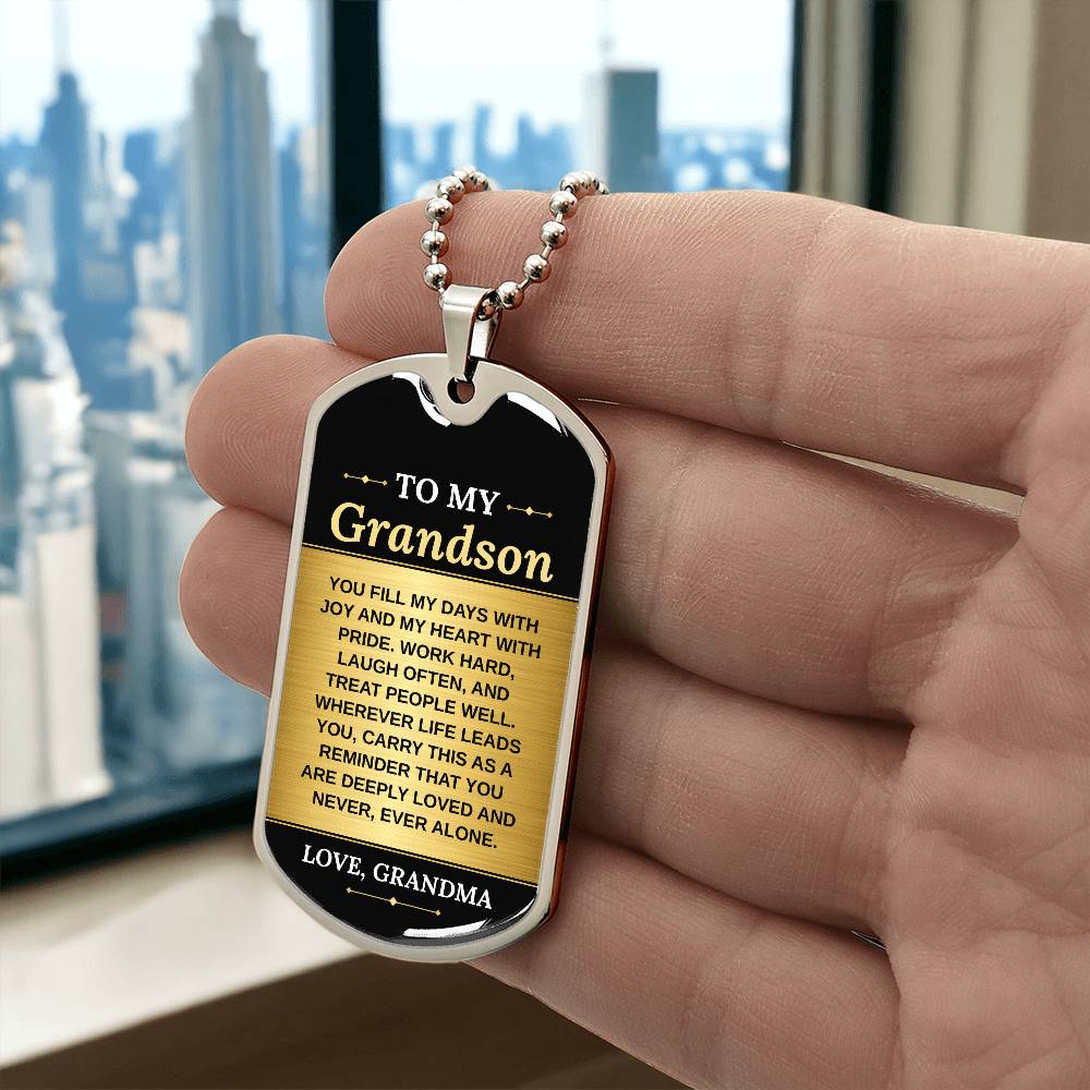 To My Grandson Necklace from Grandma – silver dog tag held in hand to show size