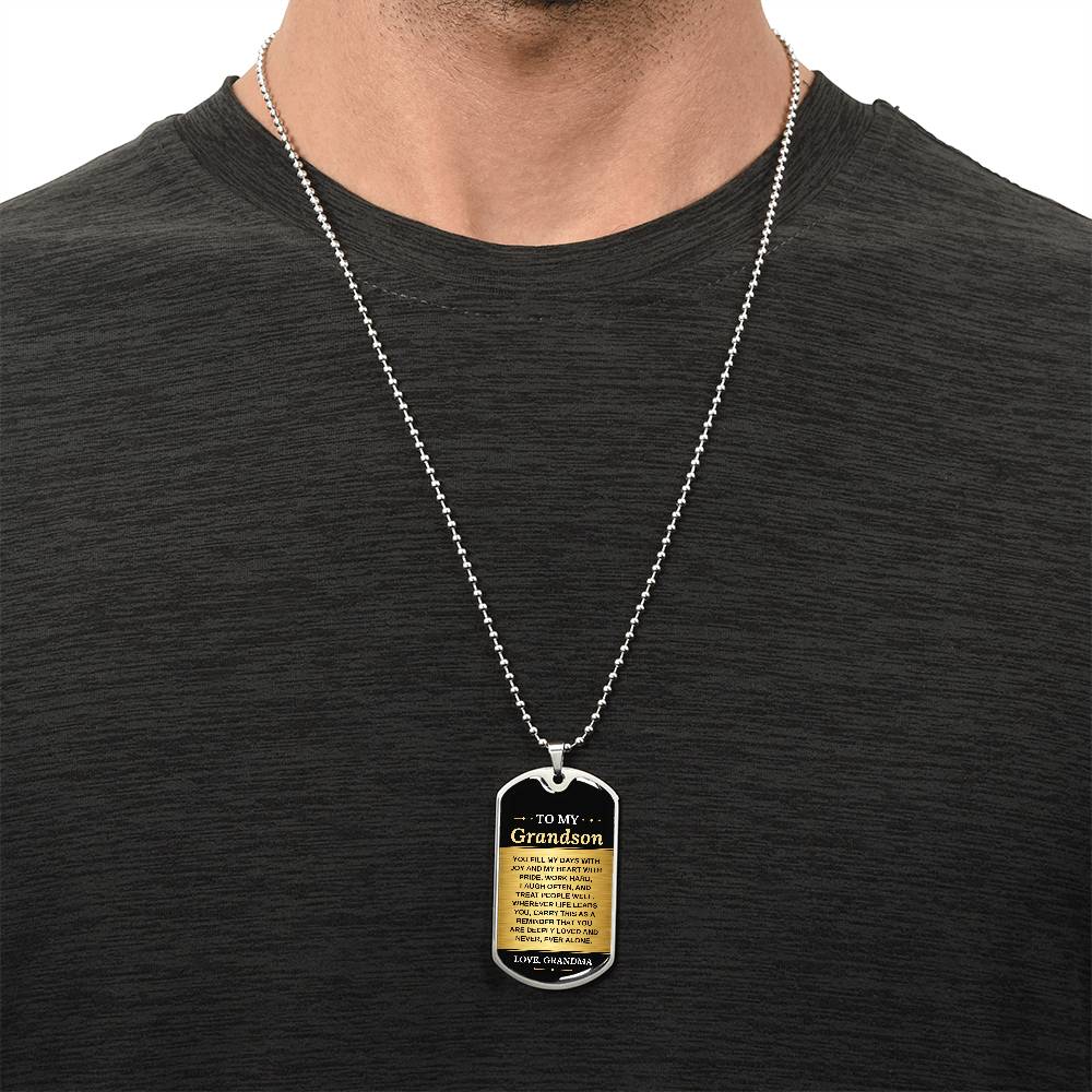 To My Grandson Necklace from Grandma – silver dog tag necklace worn with a dark t-shirt