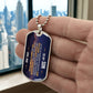 To My Son Necklace from Dad – silver dog tag held in hand to show size