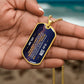 To My Son Necklace from Dad – gold dog tag held in hand to show size